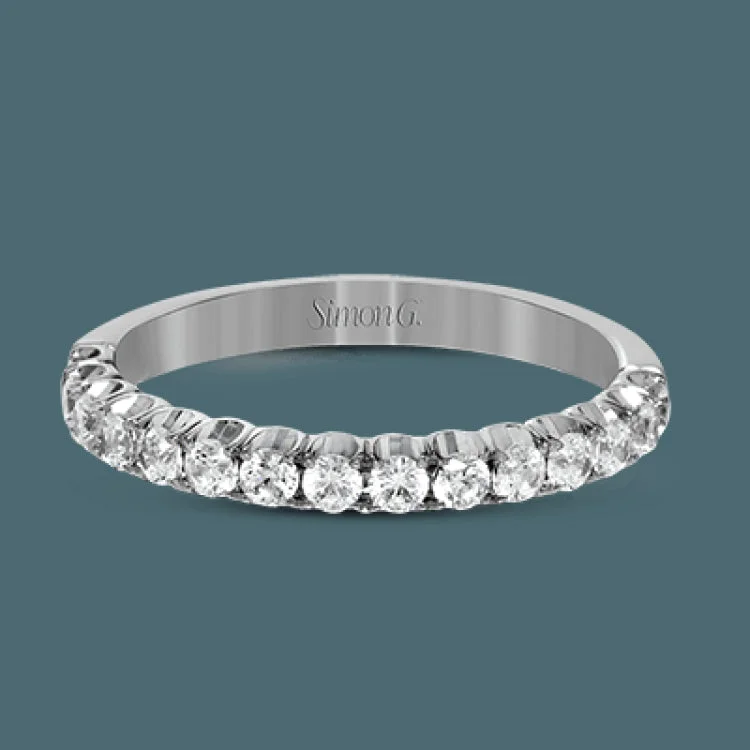 This classic wedding band contains a stunning .50 ctw of white round diamonds