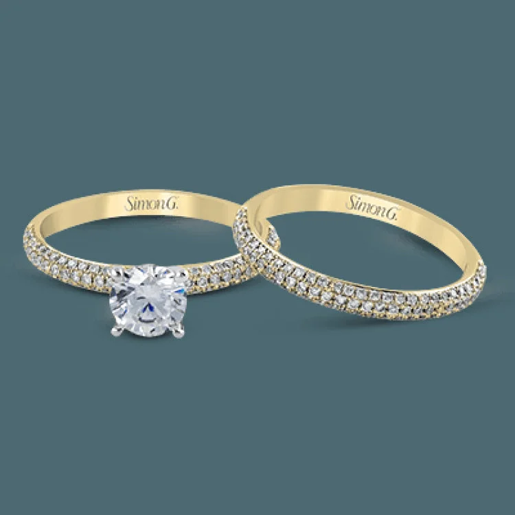 This lovely wedding set features a rounded design which is pave set with .53 ctw of white diamonds.