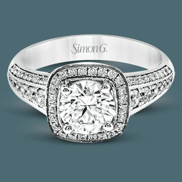 The classic design of this white gold engagement ring is emphasized by .44 ctw of dazzling round cut white diamonds.