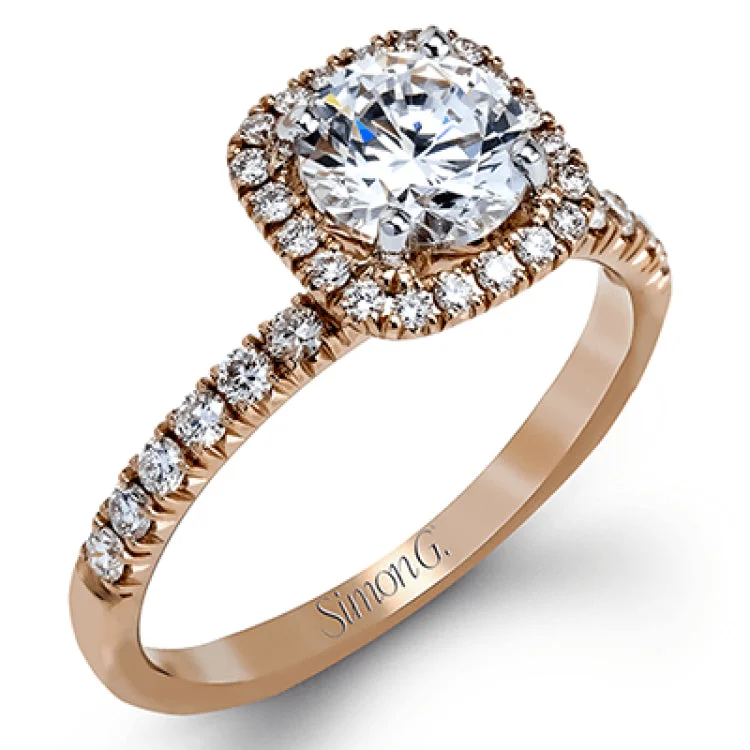 This elegant classic white gold halo engagement ring and band is set with .78 ctw of sparkling round cut white diamonds.