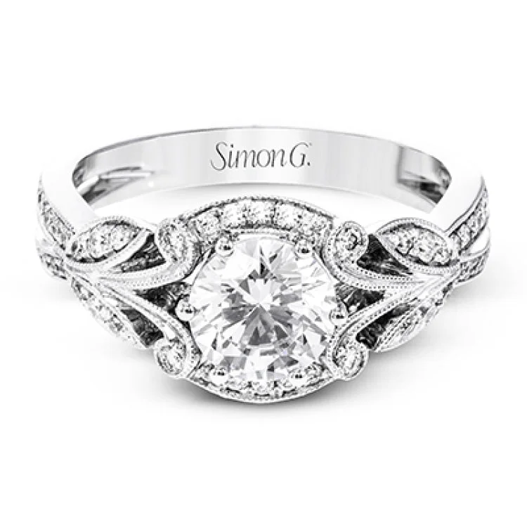 This amazing 18k white gold engagement ring features vintage-inspired design elements set with .28 ctw of white diamonds.