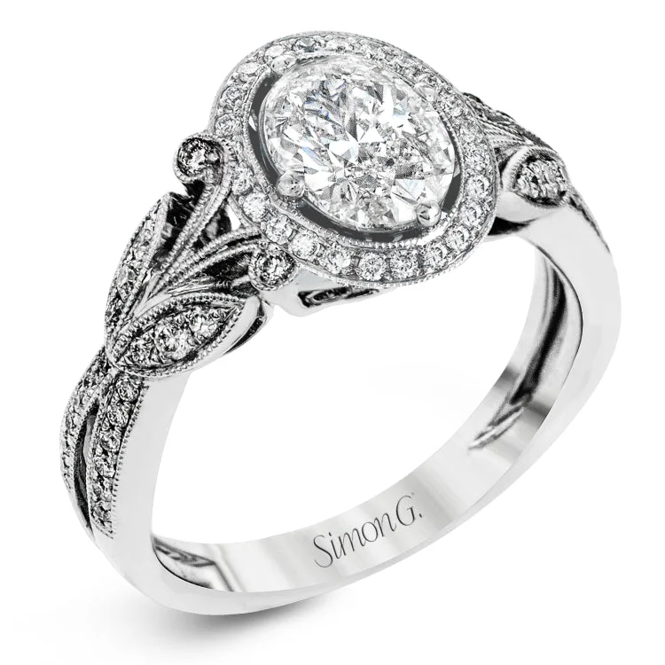 This amazing 18k white gold engagement ring features vintage-inspired design elements set with .28 ctw of white diamonds.