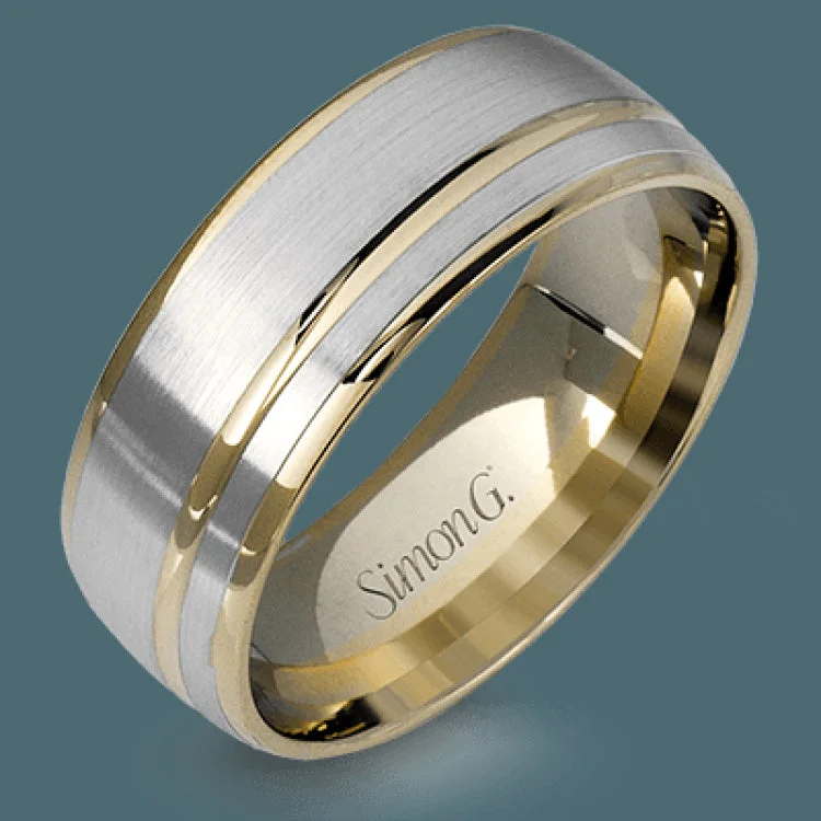 This statement men's wedding band features an accent of 14k rose gold within a 14k white gold background.