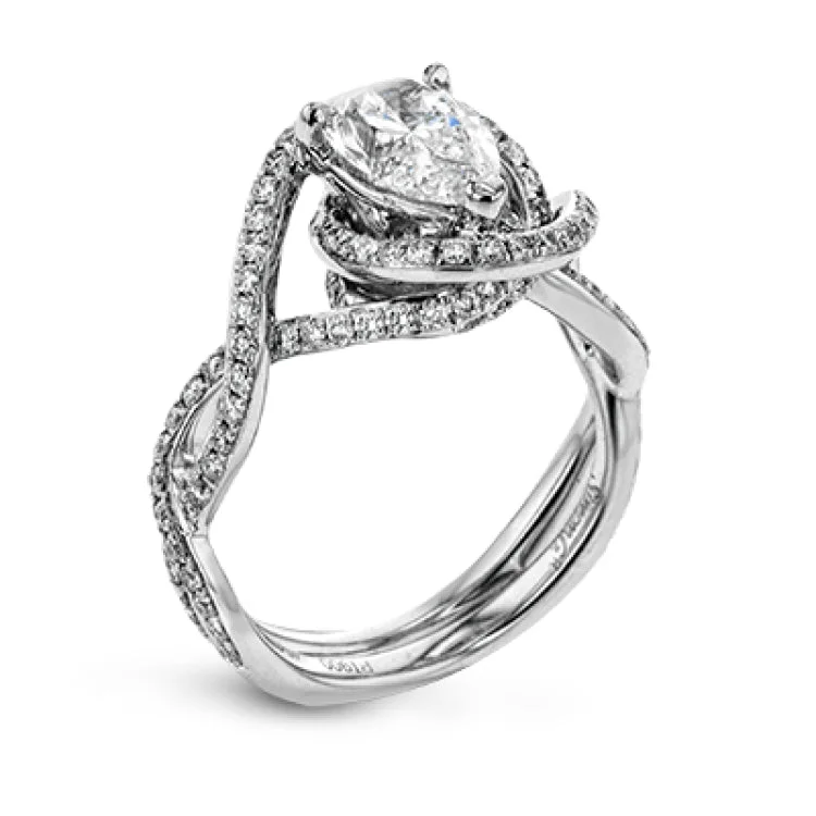 Classic with a modern twist, this white gold engagement ring features .50 ctw of sparkling white diamonds in a dramatic openwork design.