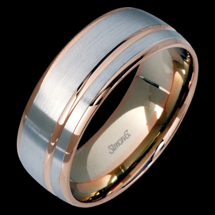 This statement men's wedding band features an accent of 14k rose gold within a 14k white gold background.