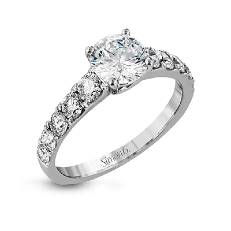 Simple yet dazzling, this white gold engagement ring features .89 ctw of round white diamonds set into the shank.