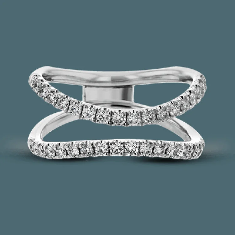 This distinctive bridal set design features a double-layer wedding band that fits around the engagement ring. The set contains .77 ctw of white diamonds.