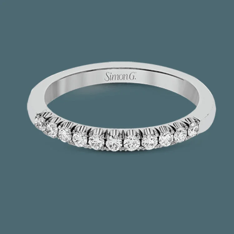 This classic wedding band features a distinctive setting style that shows off the .35 ctw of white diamonds to their full advantage.