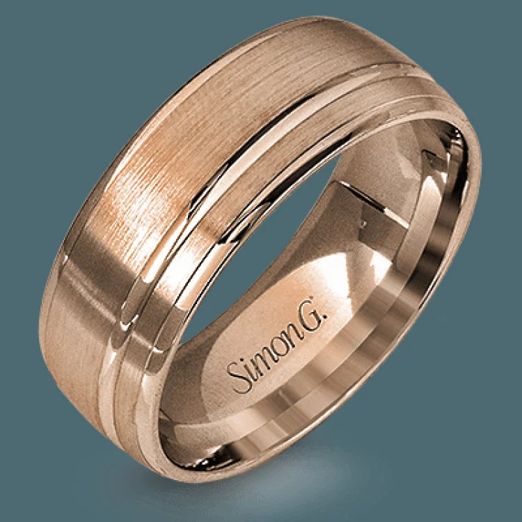 This statement men's wedding band features an accent of 14k rose gold within a 14k white gold background.