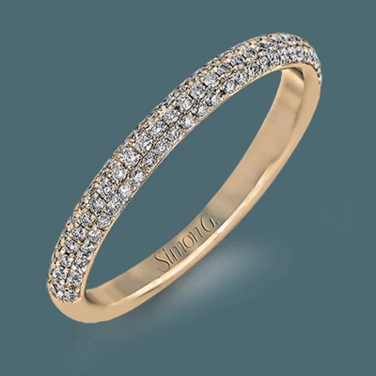 This lovely wedding set features a rounded design which is pave set with .53 ctw of white diamonds.