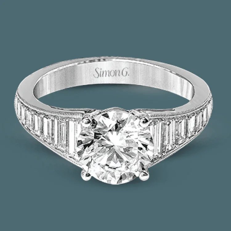 Baguette diamonds increasing in size lead the way to the center of this gorgeous engagement ring design. The outside edge is decorated with delicate milgrain, and this ring contains .98 ctw of side diamonds.