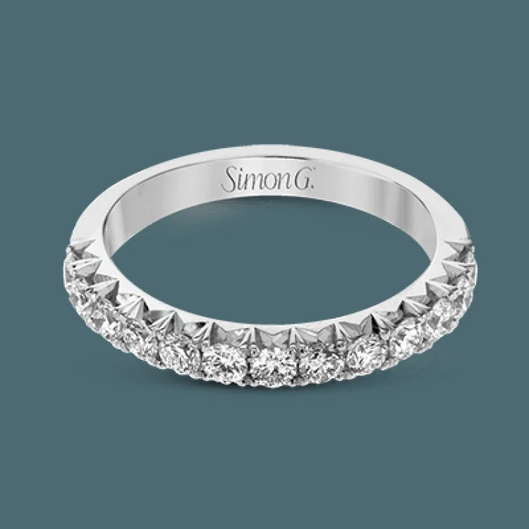 This band pairs perfectly with an engagement ring, or can be worn on its own or stacked with other rings. It contains .50 ctw of white diamonds.