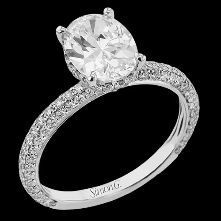 This stunning engagement ring  from our under halo collection is made for an oval center diamond, and set with 0.80 ctw of pave set diamonds in 18 kt white gold.