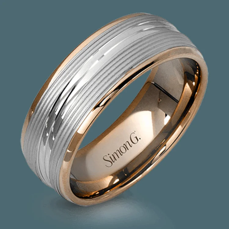 A contemporary ribbed design in lustrous white gold is outlined with two exquisite yellow gold bands in this striking men's wedding band.