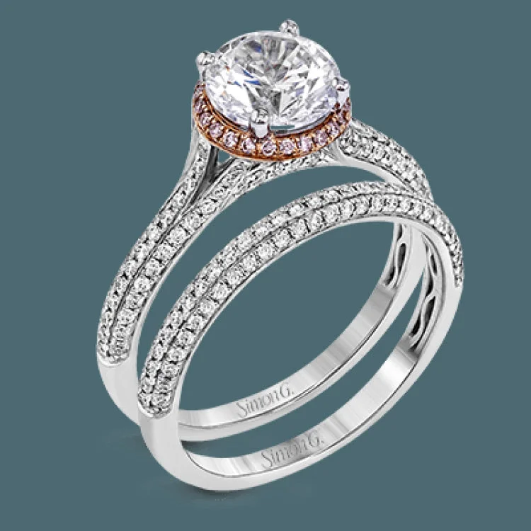 Modern and sculptural, this wedding set is crafted from 18k white and rose gold and contains .54 ctw of white diamonds and .08 ctw of pink diamonds.