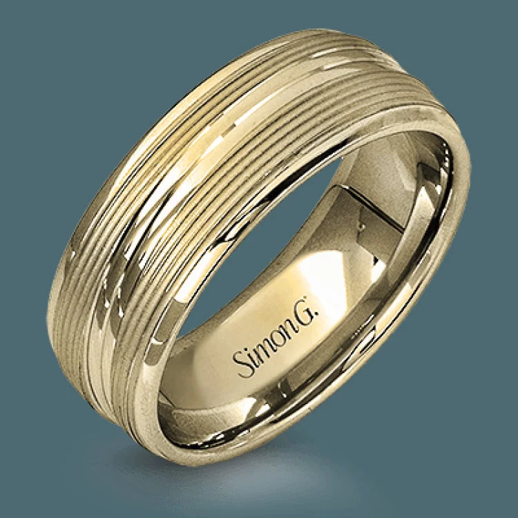 A contemporary ribbed design in lustrous white gold is outlined with two exquisite yellow gold bands in this striking men's wedding band.