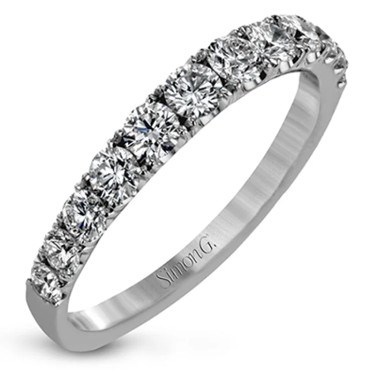 Simple yet dazzling, this white gold engagement ring features .89 ctw of round white diamonds set into the shank.