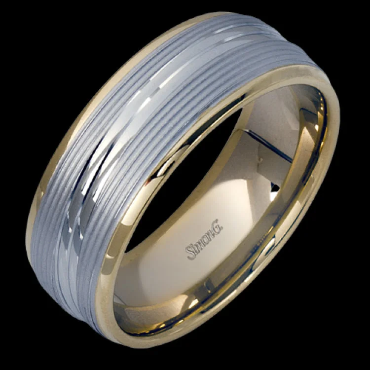 A contemporary ribbed design in lustrous white gold is outlined with two exquisite yellow gold bands in this striking men's wedding band.