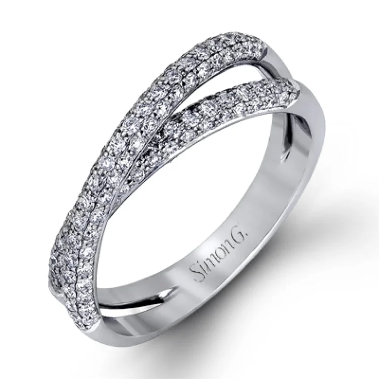 This impressive contemporary white gold engagement ring and wedding band set are emphasized by 1.00 ctw of dazzling round cut white diamonds.