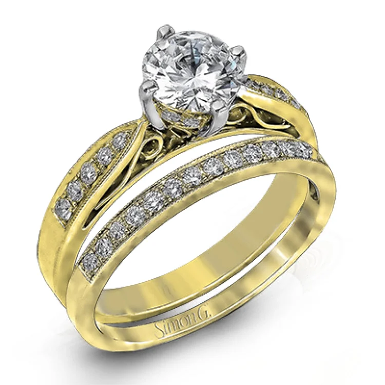 This distinctive wedding set features vintage style details and .34 ctw of white diamonds.