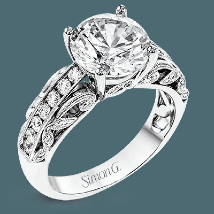 This 18k white gold engagement ring has a design taken from nature with leaves and filigree set with .43 ctw of white diamonds.