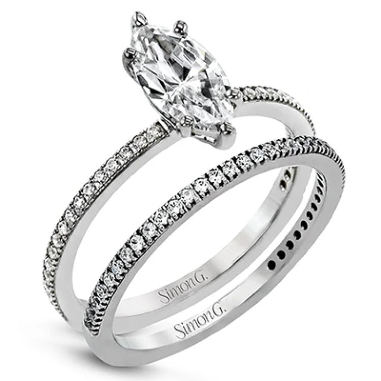 The classic, streamlined design of this 18k white gold wedding set is accented by .30 ctw of sparkling white round brilliant diamonds.