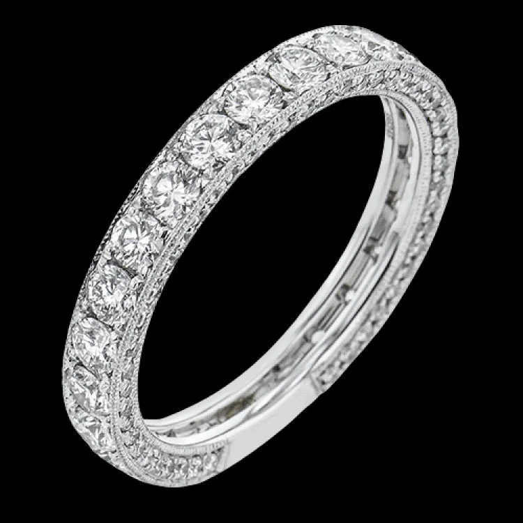 This luxe diamond anniversary band with milgrain beaded edges and diamonds on the profile 1.65 ctw., can be worn as either a wedding band or a stand alone band