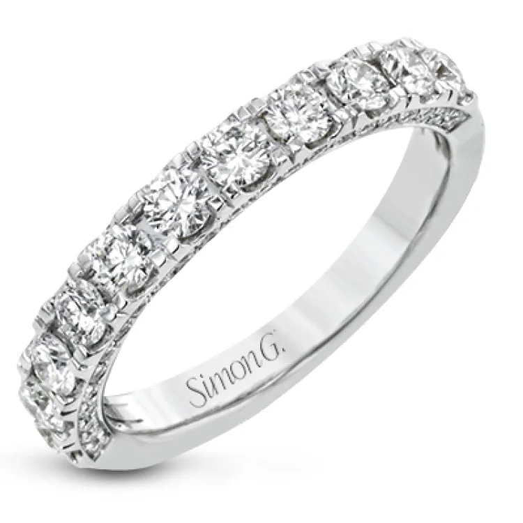 This engagement ring is stunning from every side, with .97 ctw of white round diamonds on the top and sides of the ring.