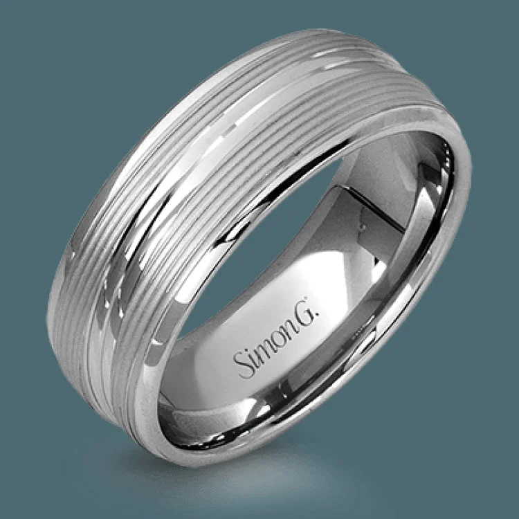 A contemporary ribbed design in lustrous white gold is outlined with two exquisite yellow gold bands in this striking men's wedding band.