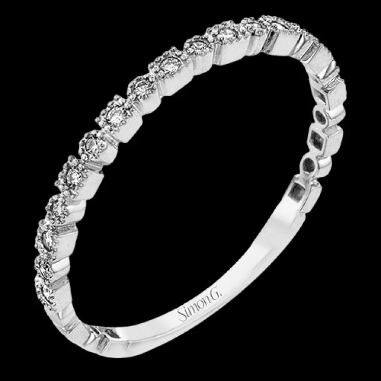 This diamond band in 14K white gold doubles as a stackable ring or a wedding band with 0.09 ctw of diamonds