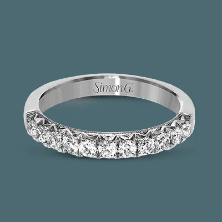 This classic wedding band features a distinctive setting style that shows off the .50 ctw of white diamonds to their full advantage.