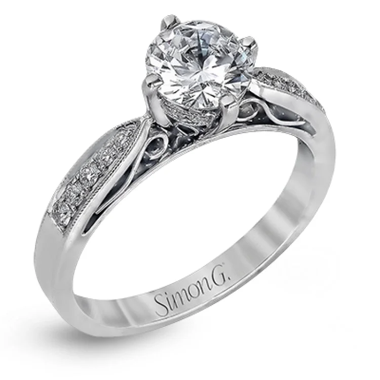 This distinctive wedding set features vintage style details and .34 ctw of white diamonds.