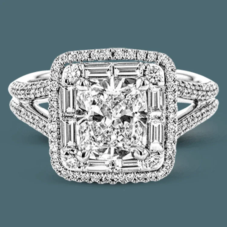 This absolutely stunning white gold engagement ring features a split shank and square halo glittering with .40 ctw of round white diamonds and .31 ctw of baguette shaped white diamonds.