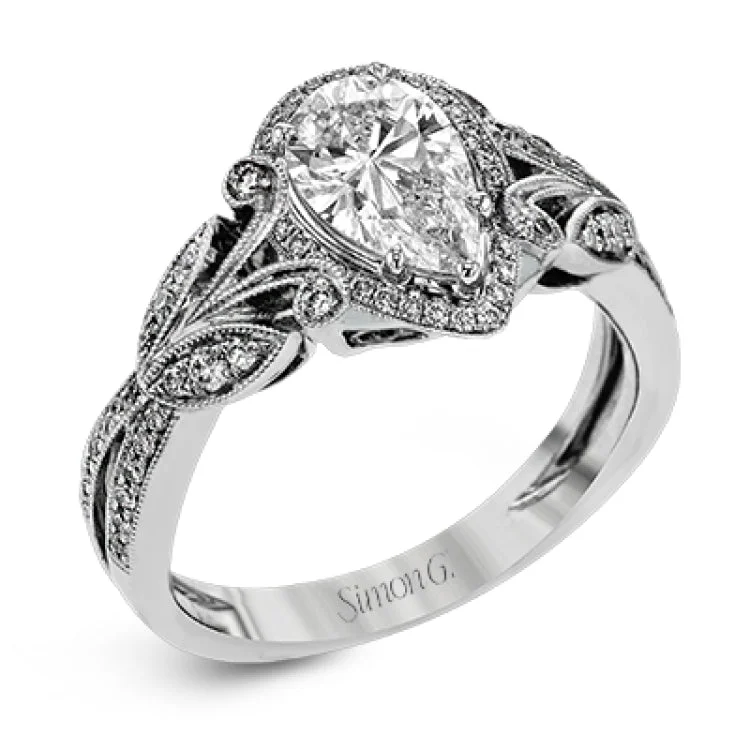 This amazing 18k white gold engagement ring features vintage-inspired design elements set with .28 ctw of white diamonds.