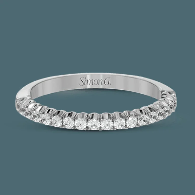 This classic wedding band contains a stunning .35 ctw of white round diamonds